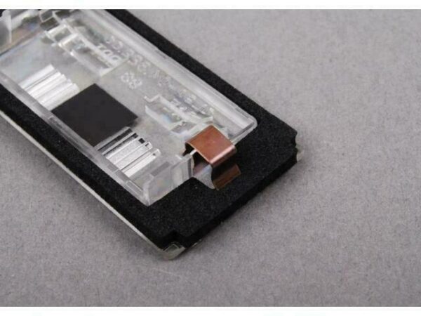 51137031085 - OEM BMW E46 COUPE LICENSE PLATE LIGHT LENS COVER 51137031085 GENUINE NEW