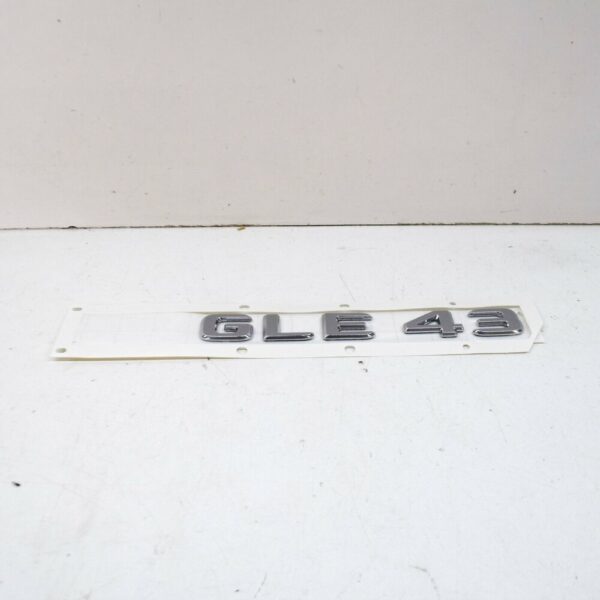 A1668176400 - NEW MB GLE W166 REAR TRUNK BOOTLID EMBLEM BADGE A1668176400 ORIGINAL
