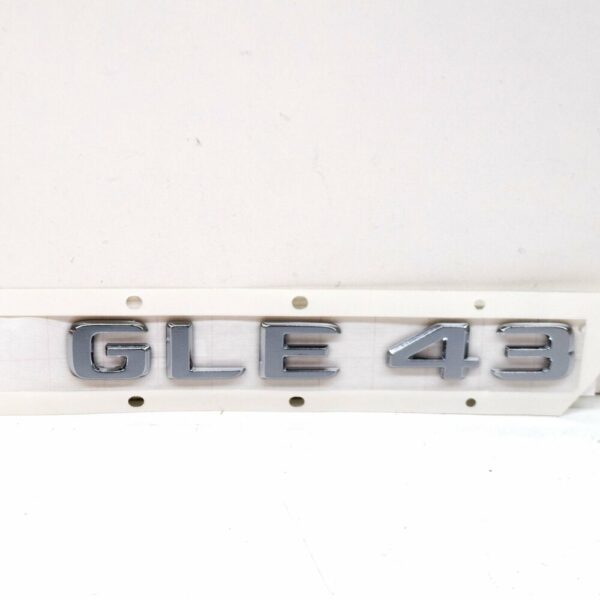 A1668176400 - NEW MB GLE W166 REAR TRUNK BOOTLID EMBLEM BADGE A1668176400 ORIGINAL