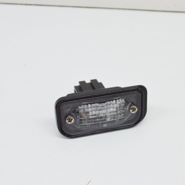 A2038200556 - Mercedes-Benz C W203 License Lamp Lens A2038200556 NEW GENUINE