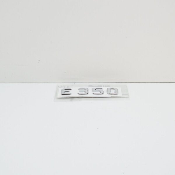 A2118170315 - NEW MB E C207 REAR TRUNK EMBLEM BADGE A2118170315 ORIGINAL