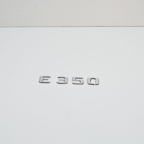 A2118170315 - NEW MB E C207 REAR TRUNK EMBLEM BADGE A2118170315 ORIGINAL