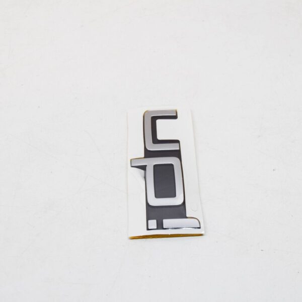 1S6853687FXC - Volkswagen UP Rear Emblem Badge 1S6853687FXC NEW GENUINE