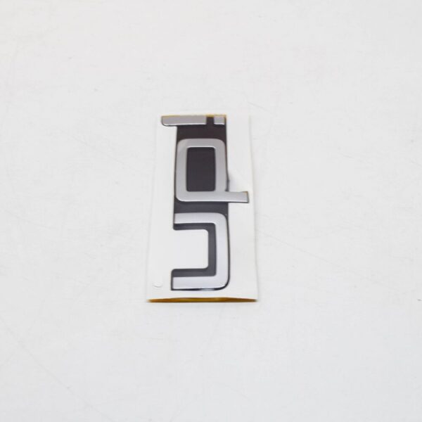 1S6853687FXC - Volkswagen UP Rear Emblem Badge 1S6853687FXC NEW GENUINE