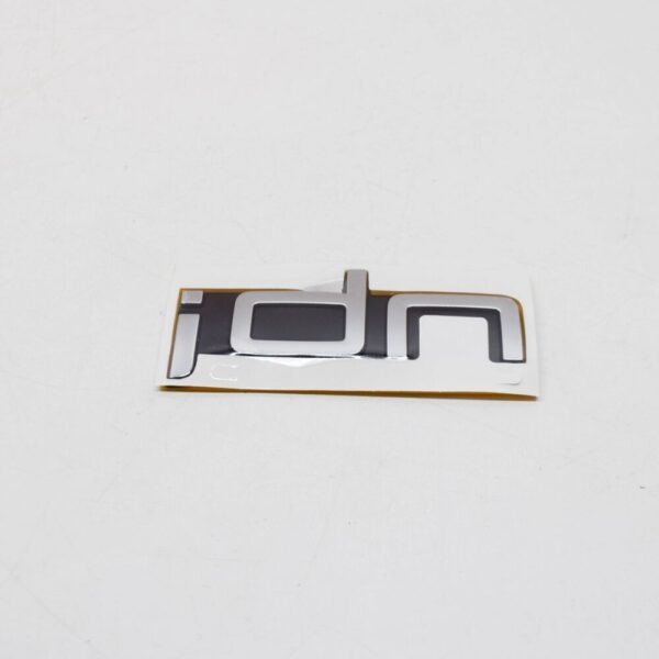 1S6853687FXC - Volkswagen UP Rear Emblem Badge 1S6853687FXC NEW GENUINE