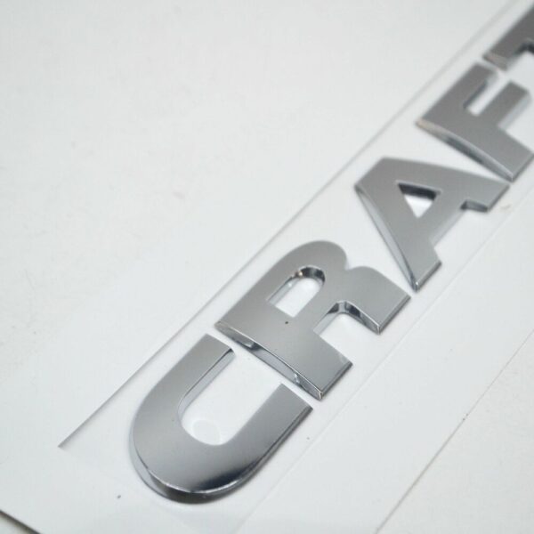 2E0853687A2ZZ - NEW VOLKSWAGEN CRAFTER MK2 REAR INSCRIPTION BADGE 2E0853687A2ZZ