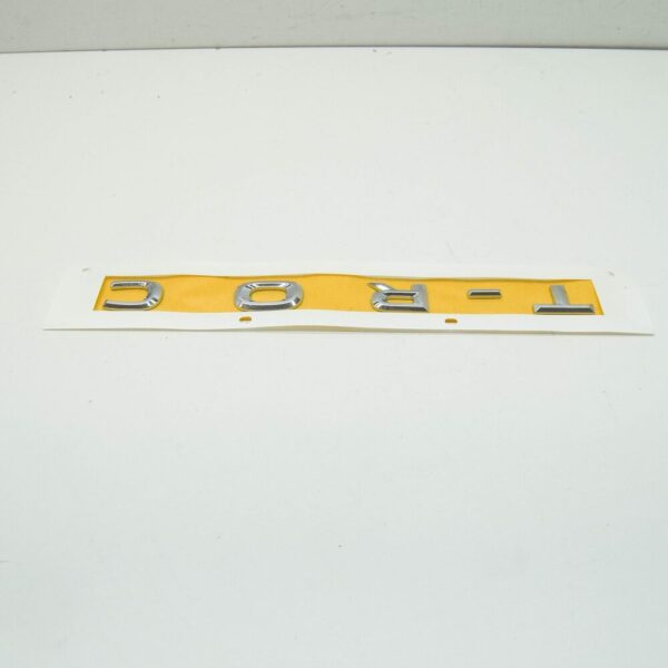2GA853687A - VW T-ROC A1 Rear Trunk Lid Inscription 2GA853687A 2ZZ 2GA853687A2ZZ NEW GENUINE
