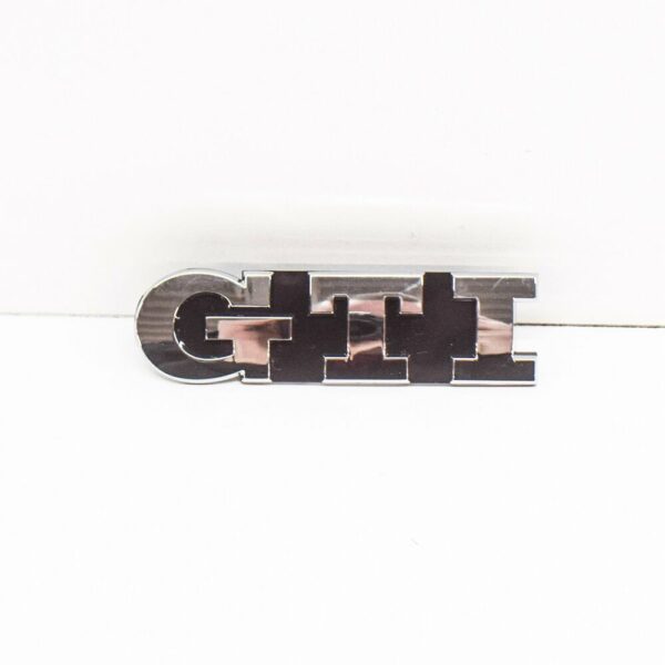 5G0853679AF - NEW VW GOLF MK7 GTI FRONT BUMPER RADIATOR GRILL EMBLEM 5G0853679AF DPJ OEM