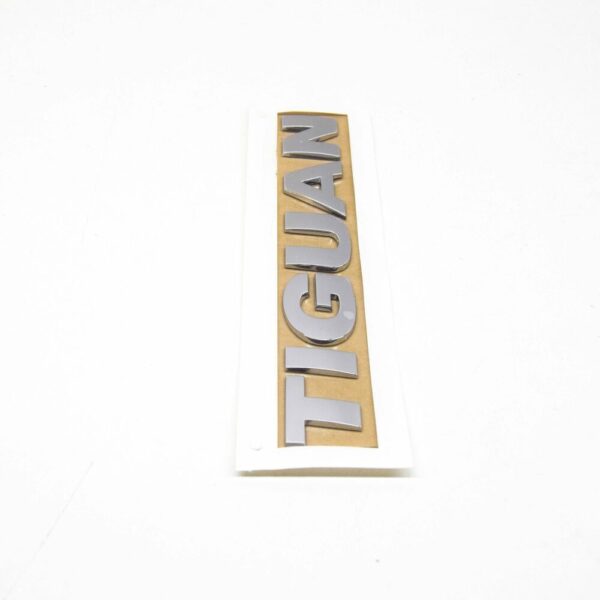 5N0853687B739 - NEW VW TIGUAN MK1 REAR TRUNK LID CHROME EMBLEM BADGE 5N0853687B739