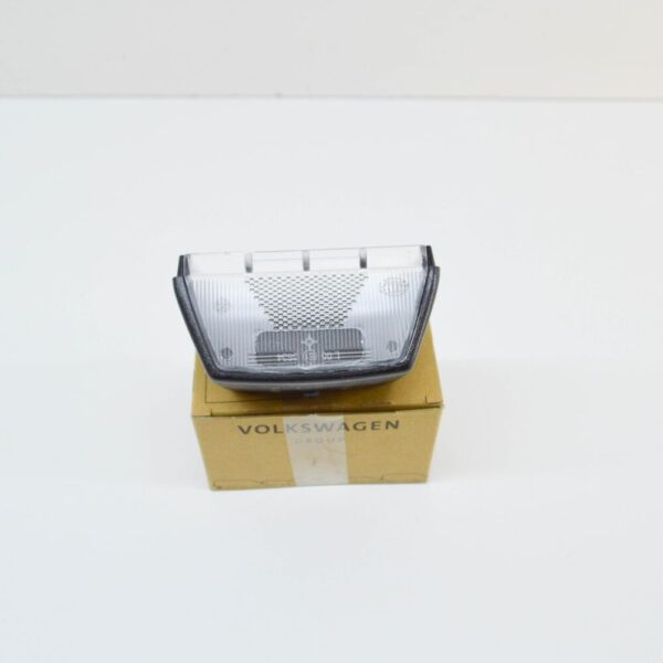 7F0943111 - NEW VOLKSWAGEN TRANSPORTER T5 NUMBER PLATE LIGHT HOLDER TRIM 7F0943111 ORIGINAL